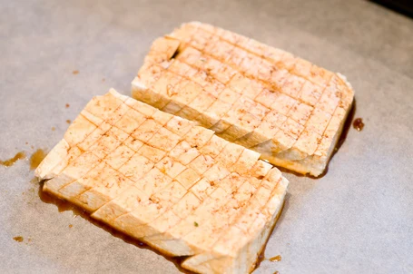 Scored tofu with the sauce