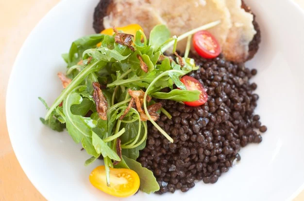 "Caviar" Lentil Salad with Arugula, Crispy Shallots and Roasted Garlic - Recipe